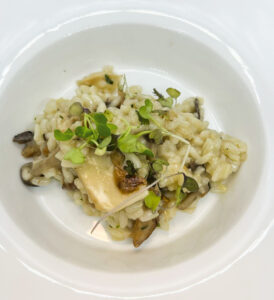 Aged Acquarello Risotto with Mixed Mushrooms and Truffle Essence (Photo courtesy of Il Pizzico)